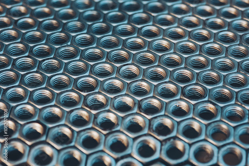 Texture pattern of a lot of screw nuts. Background of metal mounting nuts. Close up.