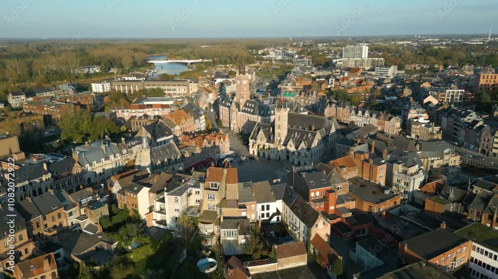 from dendermonde's grand market square river historical houses medieval canal during golden hour architectural forward aerial drone view footage shot from dendermonde's grand market square river historical houses medieval canal during golden hour architectural forward aerial drone view footage shot