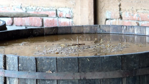 Fermenting agave pina in small vats prepares for mezcal production in oaxaca, mexico, showcasing traditional methods photo