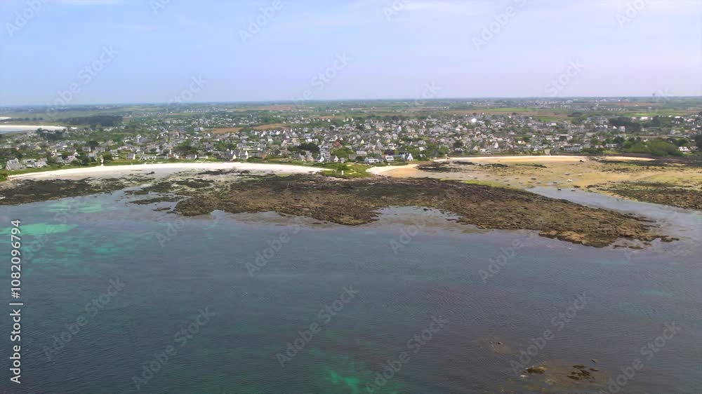 Aerial view of Brittany’s coastline near Brest, showcasing rocky shores, sandy beaches, and a coastal village. Ideal for travel and tourism, emphasizing Brittany’s unique seascape and scenic views. Aerial view of Brittany’s coastline near Brest, showcasing rocky shores, sandy beaches, and a coastal village. Ideal for travel and tourism, emphasizing Brittany’s unique seascape and scenic views.