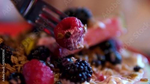 Fresh juicy raspberries close up, rotation watermelon, sesame cream, housemade granola, frozen berries, tofu cream photo