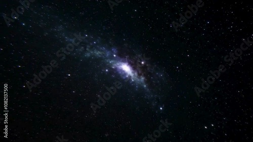 Stunning Image of a Distant Spiral Galaxy with Bright Core, Cosmic Dust, and Starfield