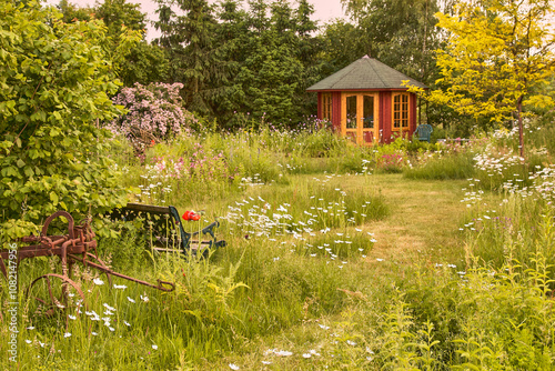 garden with red garden house in an ecologically desirable way

