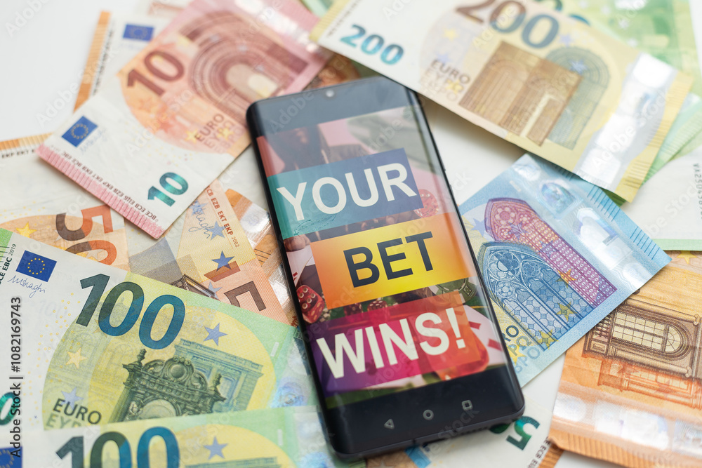 Smartphone with gambling mobile application with money close-up. Sport and betting concept