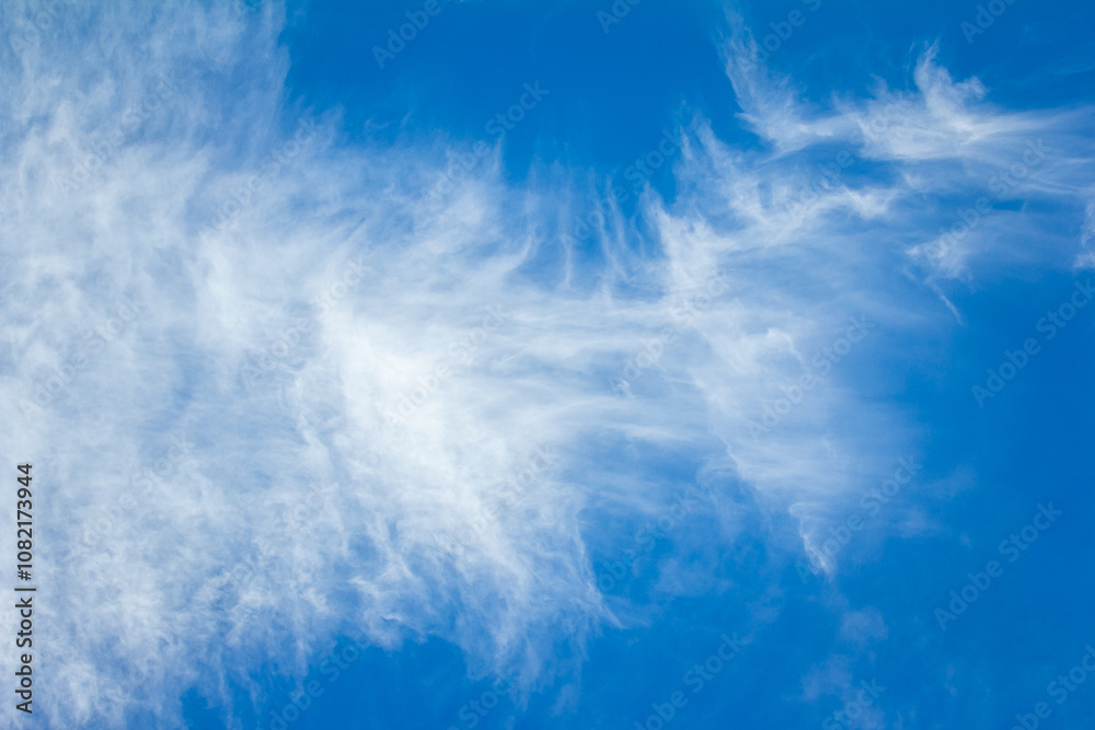 Blue Sky and Sunshine Background Big bright sunburst in right top corner, large copy space on left side with soft fluffy clouds in bottom third of image and more copy space Blue Sky and Sunshine Background Big bright sunburst in right top corner, large copy space on left side with soft fluffy clouds in bottom third of image and more copy space