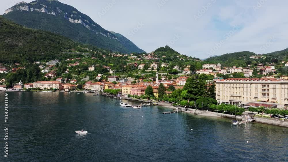 Idyllic lakeside town Menaggio on Lake Como with red rooftops and mountain views Idyllic lakeside town Menaggio on Lake Como with red rooftops and mountain views