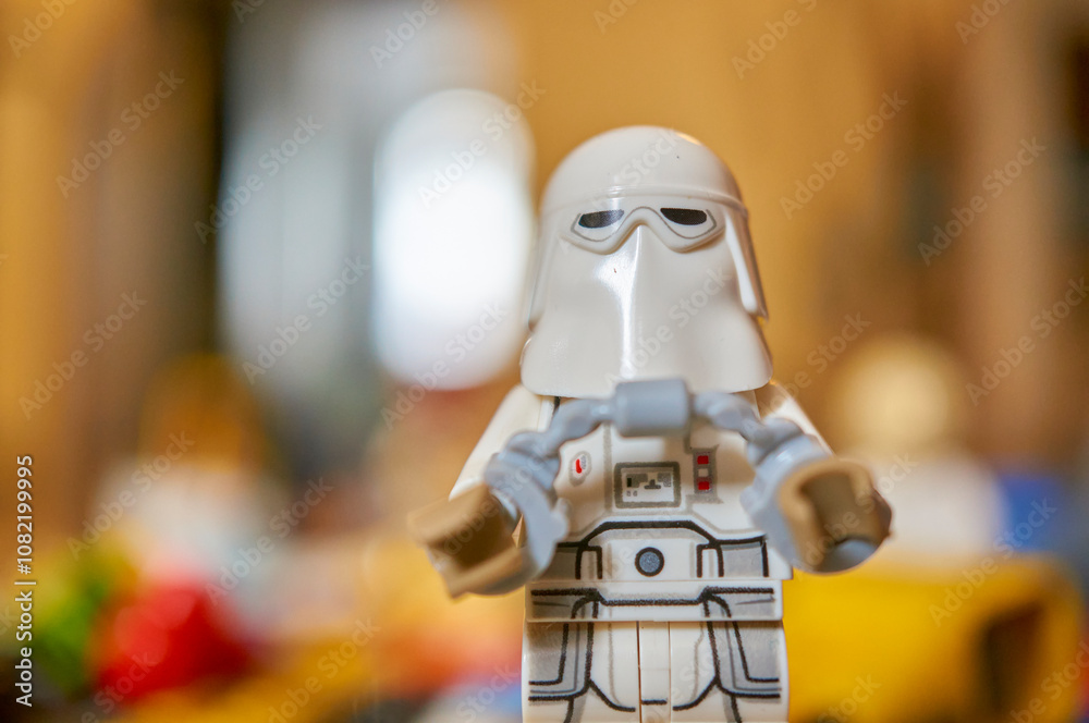 Obraz premium Lego brand Star Wars snowtrooper toy figurine with helmet and handcuffs on a blurred background