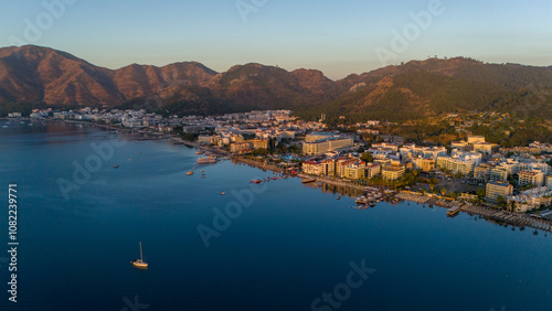 Drone aerial view of Marmaris and the mountains around during sunrise