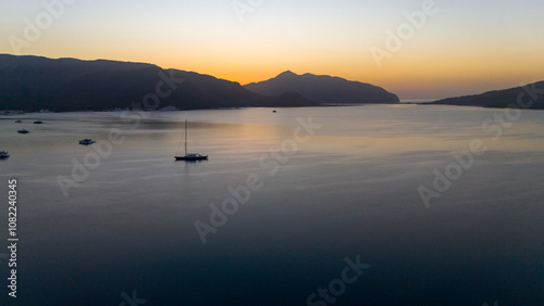 Fototapeta Naklejka Na Ścianę i Meble -  Drone aerial view of Marmaris and the mountains around during sunrise