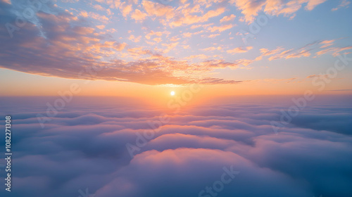 Aerial View of Sunrise Over a Sea of Clouds, Pastel Hues Paint the Sky, Serene and Tranquil Atmosphere