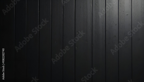 Minimalist dark black wooden background with a light matte finish and side lighting