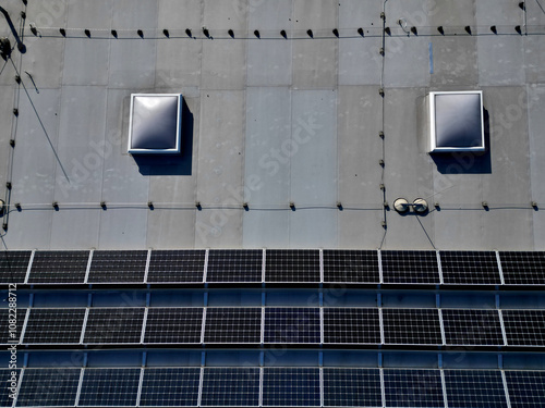  extensive roof of industrial and logistic hall are gradually being filled with solar panels. covering roofs helps industrial developer increase energy efficiency and sustainability site, building 