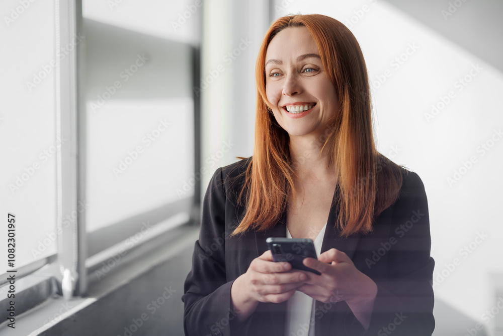 Smiling Professional Woman Holding Smartphone Smiling Professional Woman Holding Smartphone
