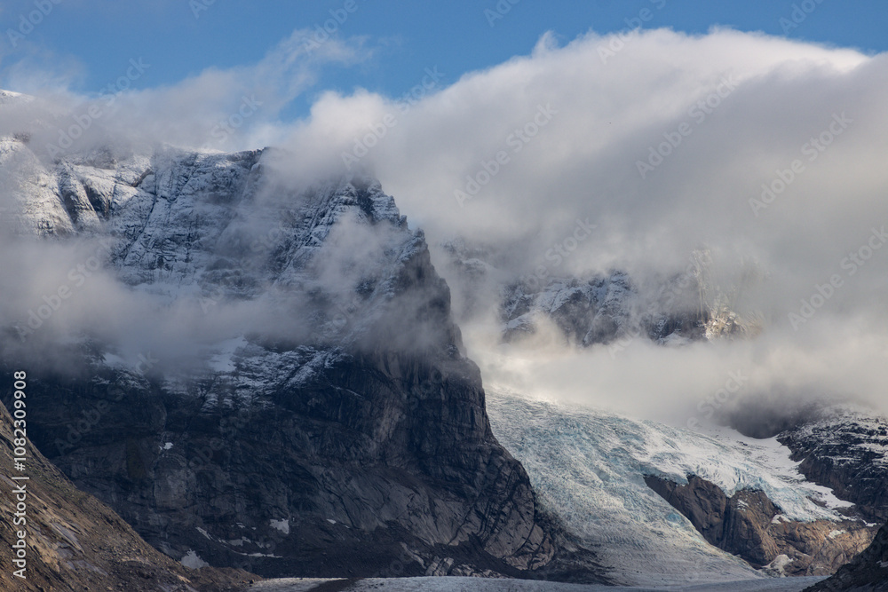 View of Ulamertorsuaq mountain and the view of surrounding mountains and glaciers in Tasermiut fjord (South Greenland) View of Ulamertorsuaq mountain and the view of surrounding mountains and glaciers in Tasermiut fjord (South Greenland)