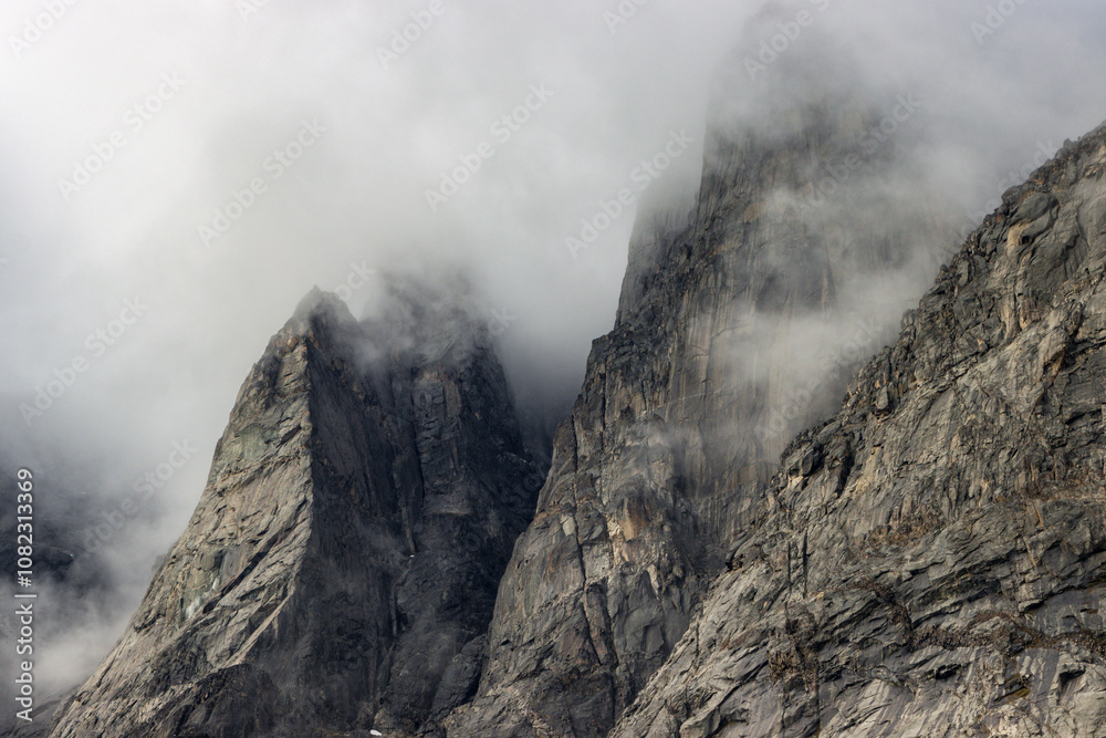 View of Ulamertorsuaq mountain and the view of surrounding mountains and glaciers in Tasermiut fjord (South Greenland) View of Ulamertorsuaq mountain and the view of surrounding mountains and glaciers in Tasermiut fjord (South Greenland)
