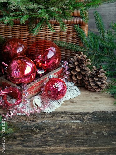 Christmas and new year holidays background. Retro red glass balls and cones on wooden table. vintage Christmas decorations. symbol of Festive winter season.