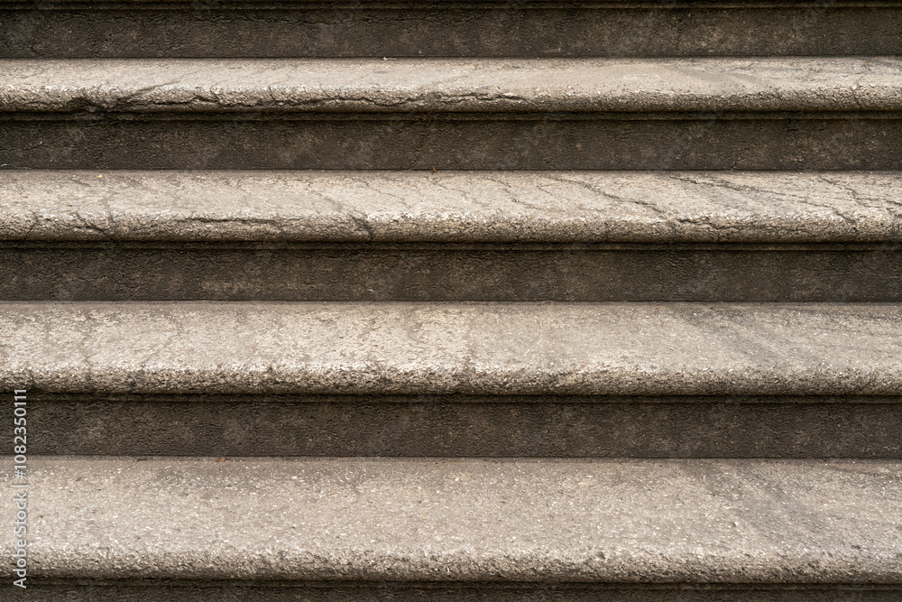 Close up view of outside old fashioned rounded stairs. Stairs are already weathered hand have signs of usage and cracks. Close up view of outside old fashioned rounded stairs. Stairs are already weathered hand have signs of usage and cracks.