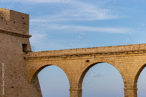 Valletta, Malta An arched stone bridge  on the Fort St. Angelo in the Birgu district.