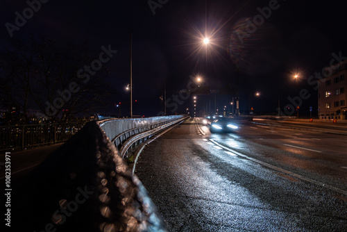 Stockholm, Sweden Traffic at night on the Liljeholmen bridge and reflecting headlights. photo