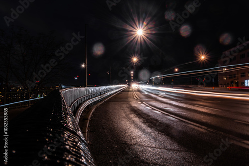 Stockholm, Sweden Traffic at night on the Liljeholmen bridge and reflecting headlights. photo