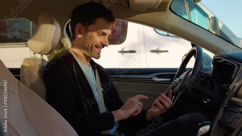 Happy man customer leaves feedback in car sharing app