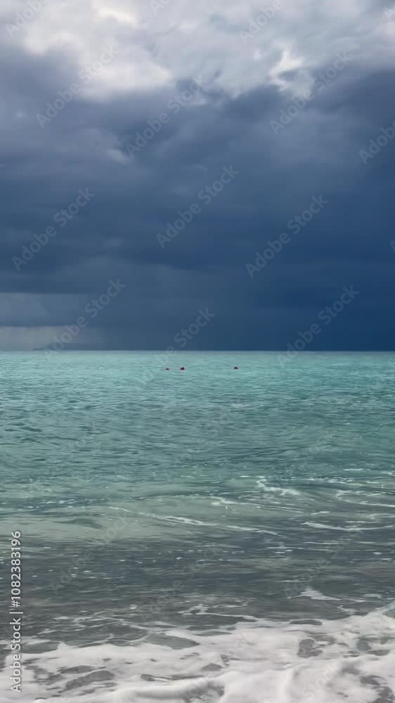 Sky, clouds, rain and storm over the ocean and mountains on the beach in Albania Sky, clouds, rain and storm over the ocean and mountains on the beach in Albania