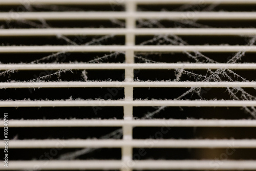 Very dirty and dusty white plastic ventilation grill. Ventilation shaft in the apartment. dirty air filter. House cleaning concept