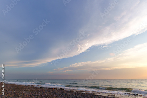 Fototapeta Naklejka Na Ścianę i Meble -  Serene Seascape with Dramatic Clouds