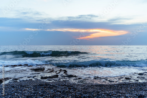 Fototapeta Naklejka Na Ścianę i Meble -  Tranquil Ocean Sunset With Vibrant Skies and Gentle Waves..