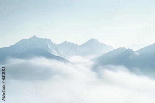 Serene Mountain Landscape with Soft Misty Clouds