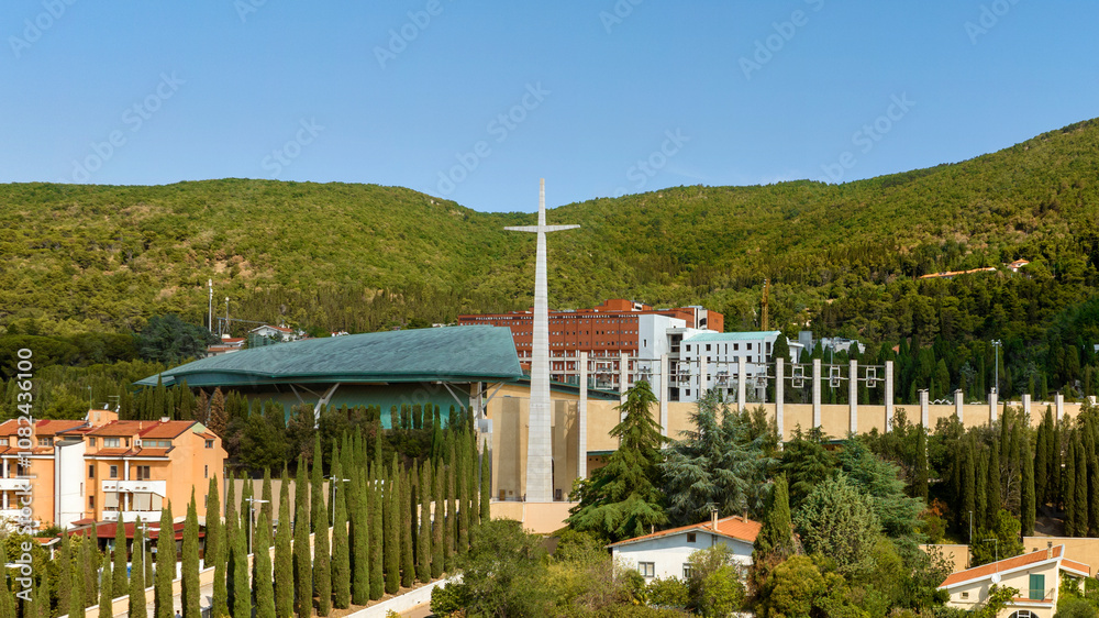 Aerial view of the monumental cross at the entrance to the Sanctuary of Saint Pio of Pietrelcina. It is a Catholic shrine in San Giovanni Rotondo, in the province of Foggia, in Puglia, Italy. Aerial view of the monumental cross at the entrance to the Sanctuary of Saint Pio of Pietrelcina. It is a Catholic shrine in San Giovanni Rotondo, in the province of Foggia, in Puglia, Italy.