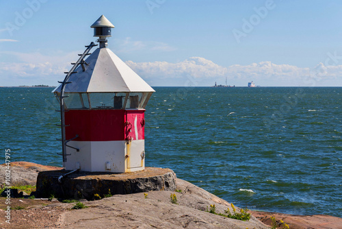 Lighthouse on islands of Suomenlinna sea fortress southest form Helsinki city center, Finland, sunny summer day, UNESCO World Heritage Site photo