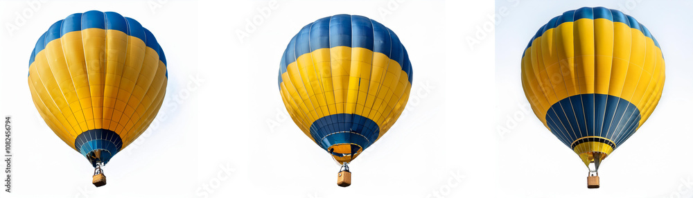 Fototapeta premium Three yellow and blue hot air balloons float in a white sky.