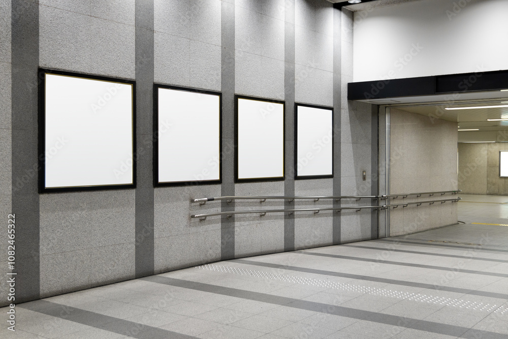 Four squares blank billboard advertising poster on a subway station hall. Space for text for advertising signage ideas for mockup
