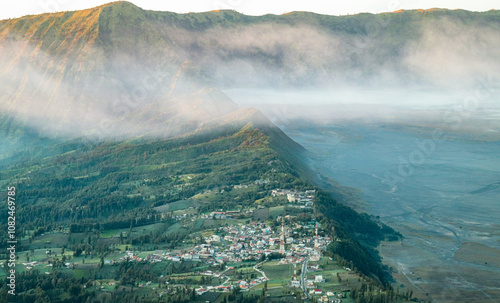 Misty Morning View of Cemoro Lawang, Indonesia photo