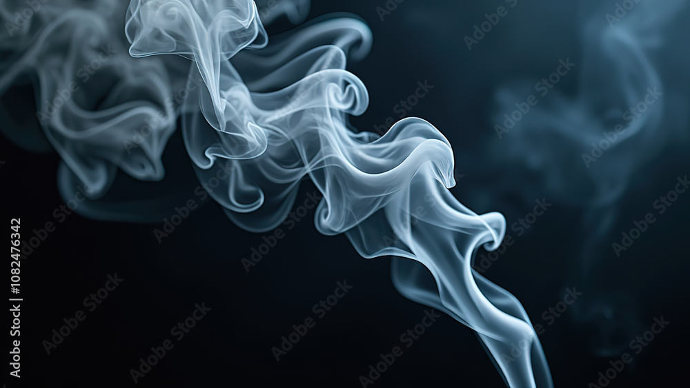 Abstract smoke swirls on a dark background creating an ethereal mood. Abstract smoke swirls on a dark background creating an ethereal mood.