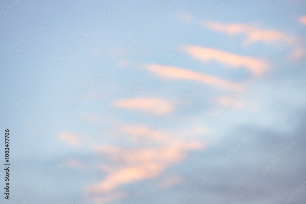 A beautiful sky tinted by the sun leaving vibrant shades of gold, pink, blue and multicolored. Clouds in the twilight evening and morning sky. Cloudy sky background in the evening, and during the day. A beautiful sky tinted by the sun leaving vibrant shades of gold, pink, blue and multicolored. Clouds in the twilight evening and morning sky. Cloudy sky background in the evening, and during the day.