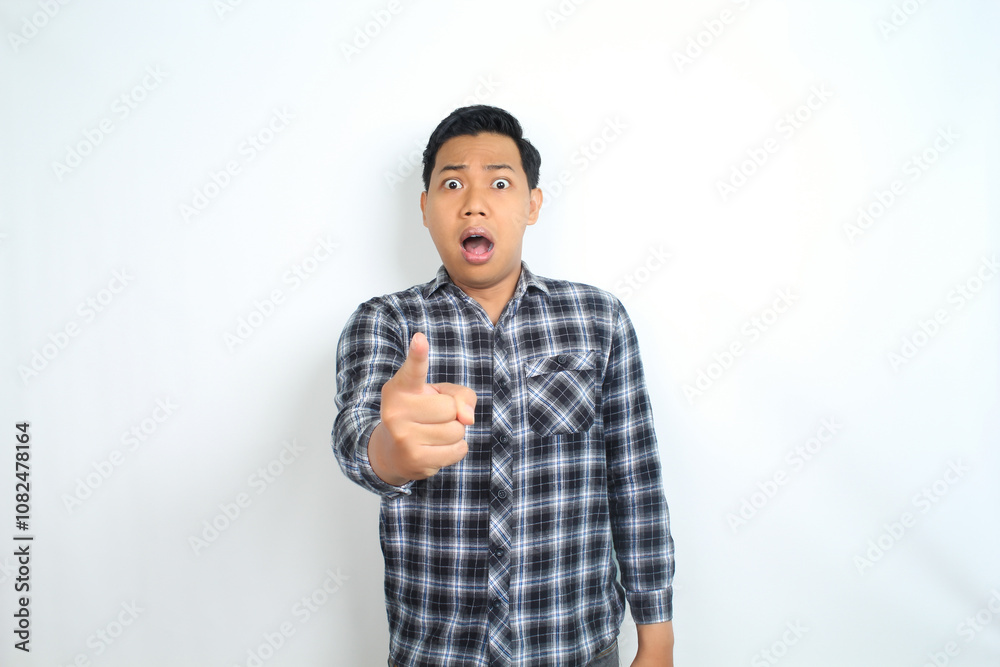 shocked asian man pointing finger with scared face isolated on white wearing casual shirt shocked asian man pointing finger with scared face isolated on white wearing casual shirt
