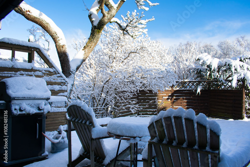 snow covered backyard patio furniture norway photo