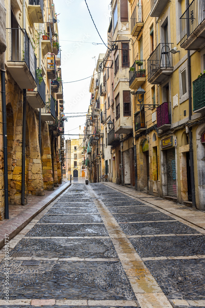 narrow street in the ancient city of Tarragona, Spain