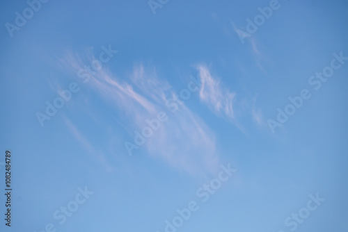 A beautiful sky tinted by the sun leaving vibrant shades of gold, pink, blue and multicolored. Clouds in the twilight evening and morning sky. Cloudy sky background in the evening, and during the day.