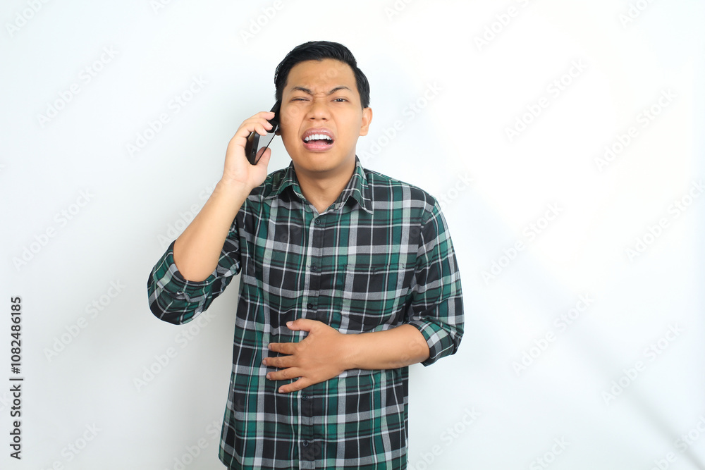 asian man feel stomach ache while talking on smartphone, maag, unhealthy, isolated on white background asian man feel stomach ache while talking on smartphone, maag, unhealthy, isolated on white background