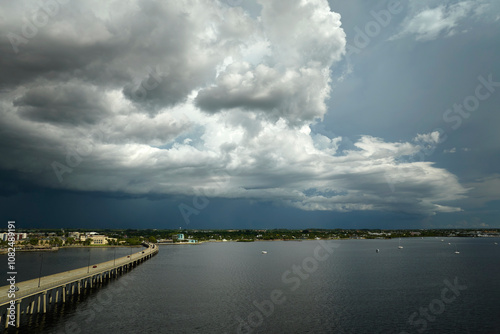 Wallpaper Mural Heavy thunderstorm approaching traffic bridge connecting Punta Gorda and Port Charlotte over Peace River. Bad weather conditions for driving during rainy season in Florida Torontodigital.ca
