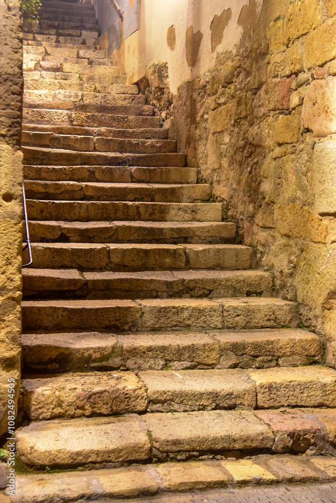 old stone stairs in the streets of the roman ancient city of Tarragona old stone stairs in the streets of the roman ancient city of Tarragona