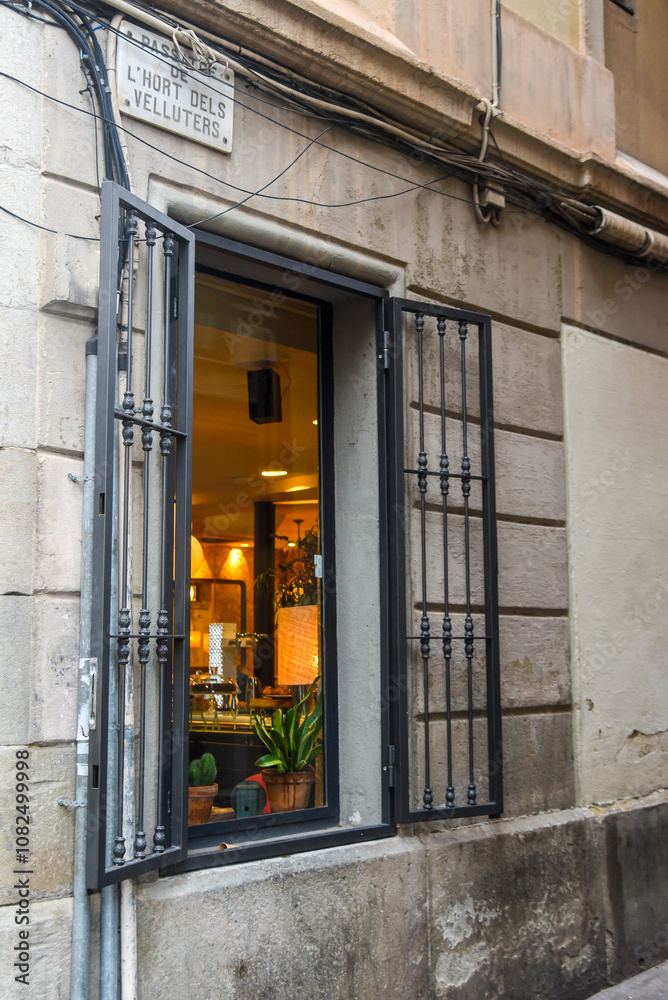old open window in the streets on the old city in Barcelona