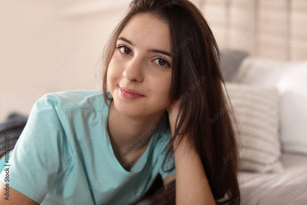 Portrait of teenage girl on bed at home Portrait of teenage girl on bed at home
