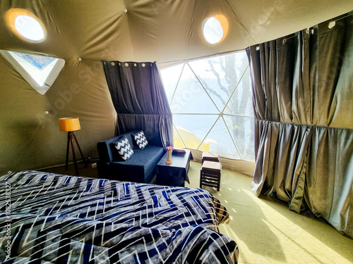 Interior of geodesic, triangular and swiss tents at a popular glamping spot near hampta village manali for eco freindly and comfortable adventure stays photo