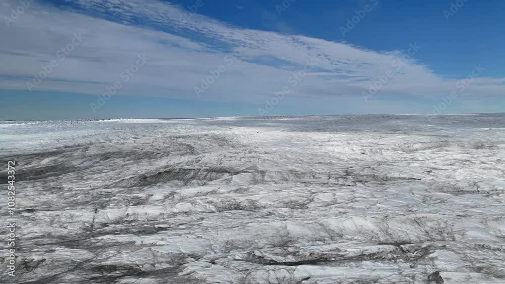 Vast aerial view of the Greenlandic ice cap during sunshine wiht blue sky, near Kangerlussuaq. Vast aerial view of the Greenlandic ice cap during sunshine wiht blue sky, near Kangerlussuaq.