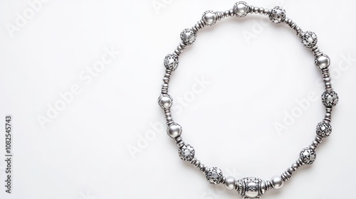 Wallpaper Mural A silver beaded necklace displayed on a white background. Torontodigital.ca