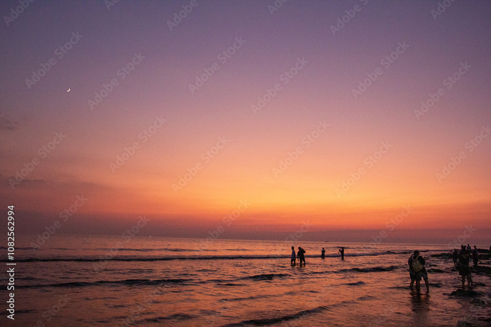 a purple and orange sky with a sunset in the background a purple and orange sky with a sunset in the background